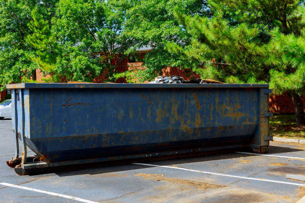 dumpsters being full with garbage in a city. dumpsters being full with garbage